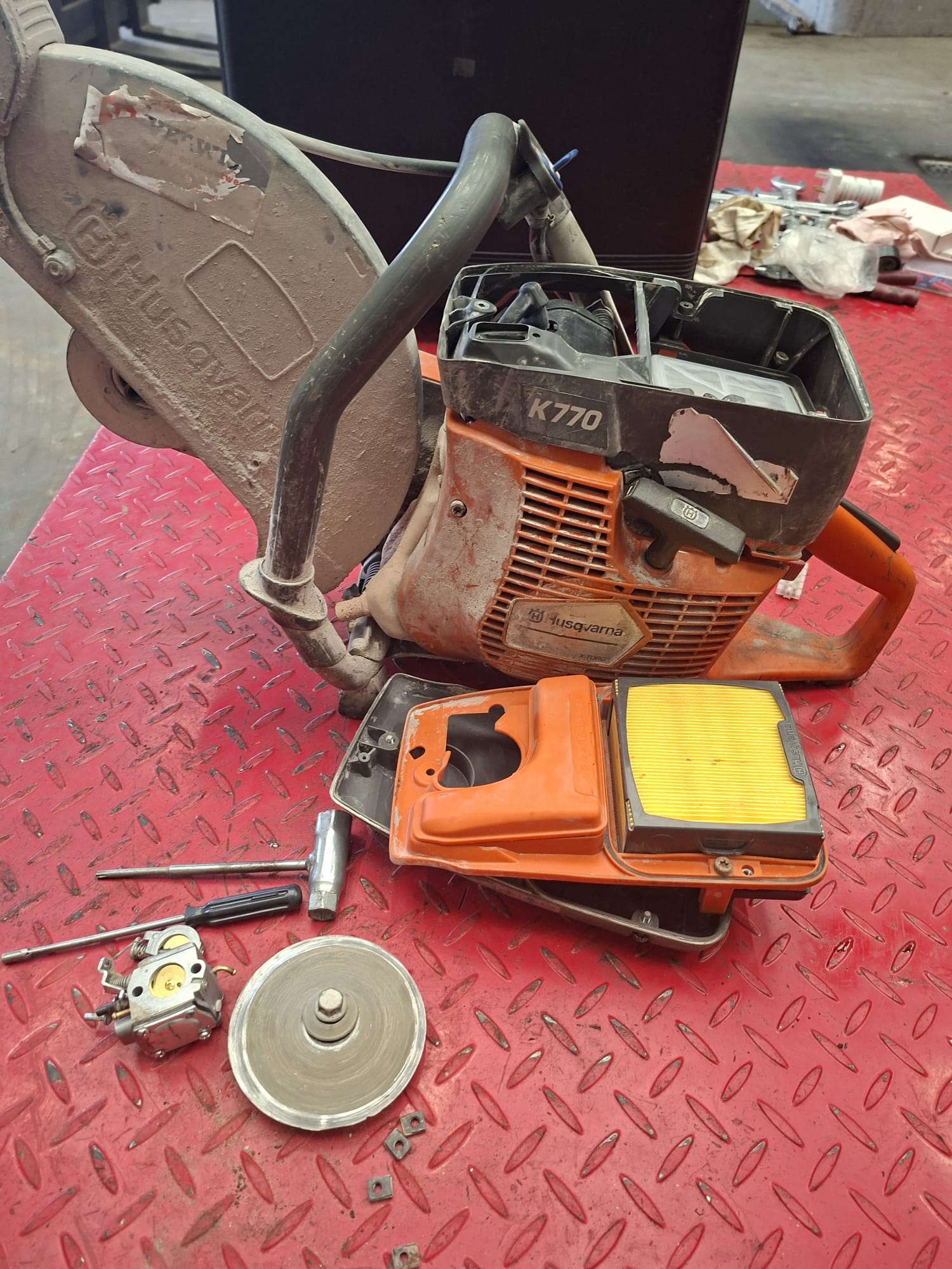 Disassembled motor sharpener on red surface