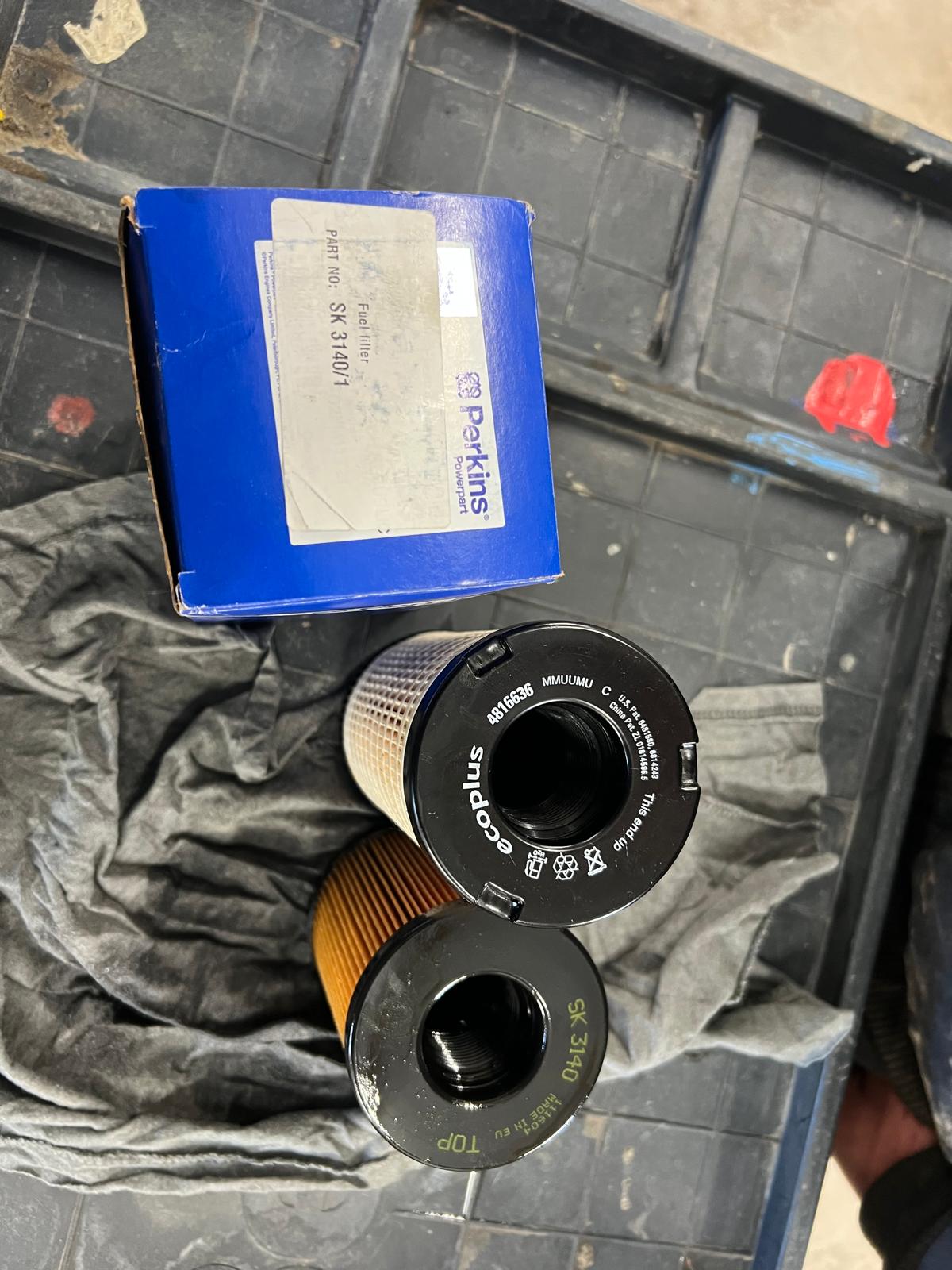 Two oil filters with packaging.